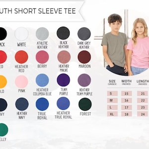 May include: A product image showcasing a youth short sleeve tee. The image displays a color chart with options like black, white, red, gold, navy, and more. Size, width, and length measurements are provided in inches. Two children model the tee.