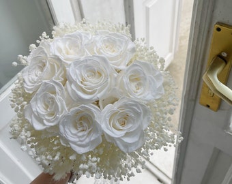 White classic royal wedding bouquet of the bride with a white rose and gypsophila lace ribbon dried flowers baby's breath boutonniere rustic