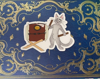 May include: A gray cat with a white bandage on its head is playing a drum with a drumstick. The drum is brown with a gold rim and is on a wooden stand.