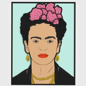 May include: A framed art print depicting a stylized portrait of a woman with dark hair, a floral headpiece, and gold earrings. The portrait has a light blue background and a black frame. The woman is wearing a black jacket and a gold necklace.