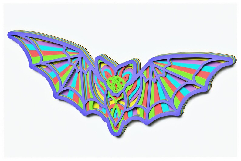 May include: A colourful layered paper bat with a rainbow striped design. The bat is cut out of paper and has a 3D effect.