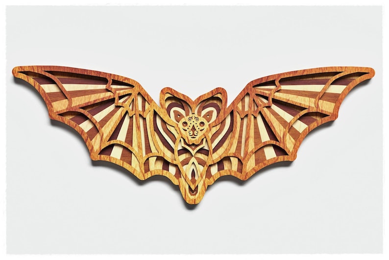 May include: A wooden bat cutout with a striped pattern in shades of brown and beige. The bat has a detailed face with intricate carvings.