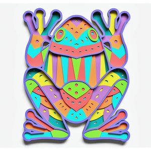 Puede incluir: Un recorte de papel colorido de una rana con patrones geométricos en tonos de azul, verde, amarillo, naranja, rosa y morado. La rana está sentada sobre un fondo blanco.