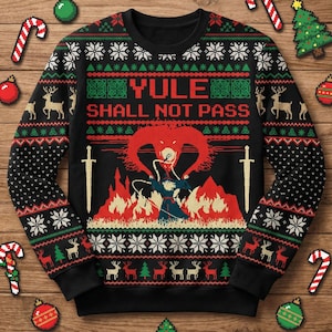 May include: Black Christmas sweater with the text "YULE SHALL NOT PASS" and a graphic of a wizard battling a fiery creature. The sweater features snowflakes, reindeer, and Christmas tree patterns in red, green, and white.
