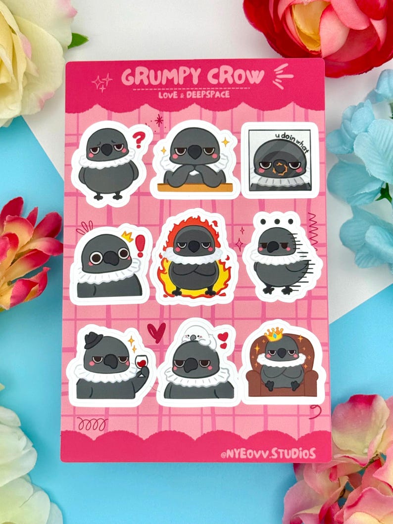 May include: Sheet of stickers featuring a cartoon crow with various expressions. The crow is primarily gray with a white ruffled collar. The stickers have text that reads "GRUMPY CROW LOVE & DEEPSPACE" and "u doin what". The background is pink.