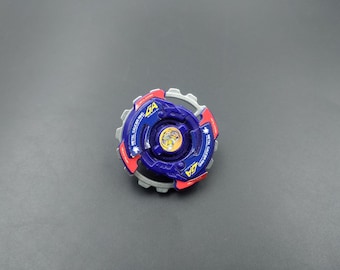 May include: A blue and red spinning top with a silver gear and the text "METAL FIGHTING" on the side. The top has a yellow and black design in the centre.