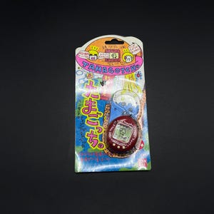 SKU B222P2515 / Juguete virtual Tamagotchi de cuerpo duro rojo con pantalla LCD