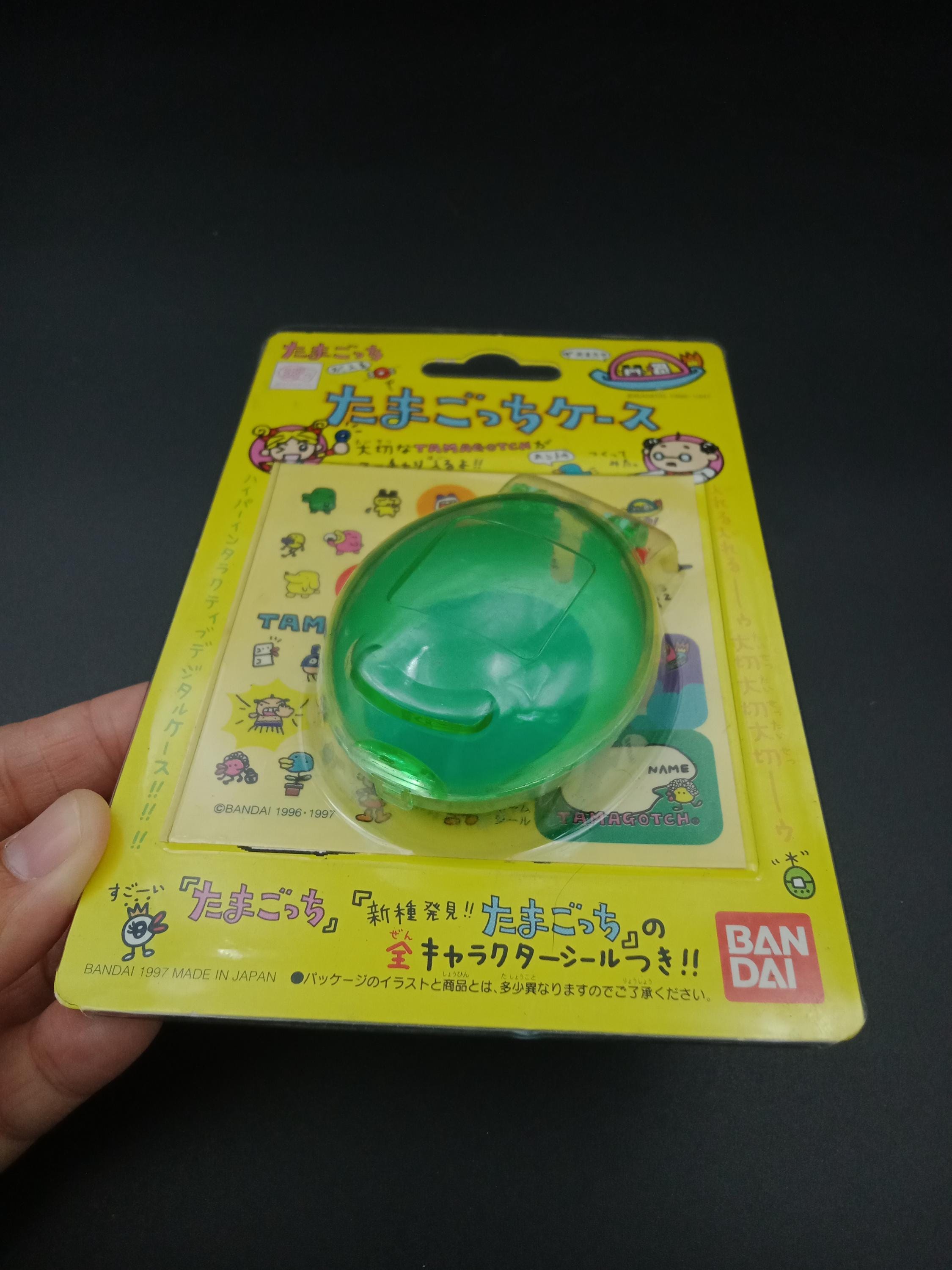 SKU YY15 | Bandai Tamagotchi Green Clear Egg Case With Stickers