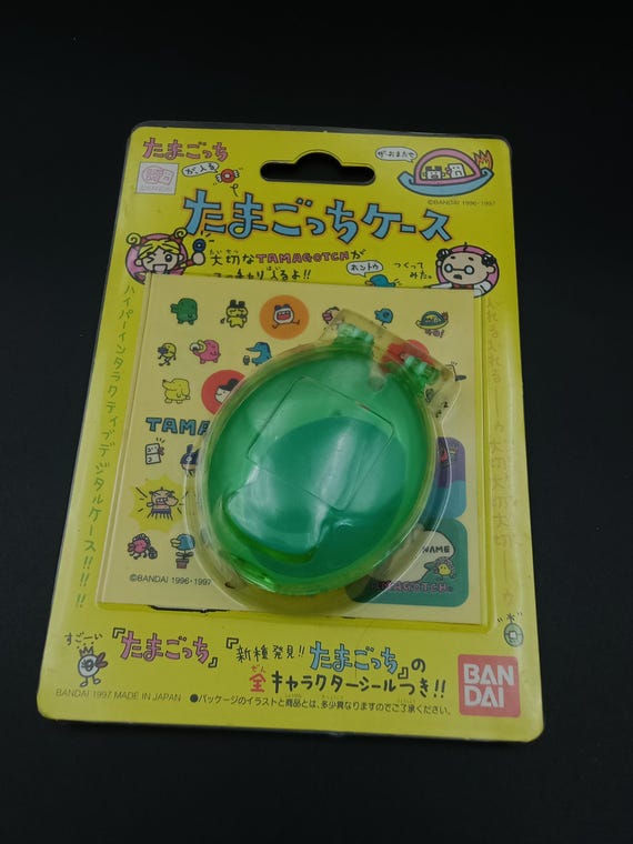 SKU YY15 | Bandai Tamagotchi Green Clear Egg Case With Stickers