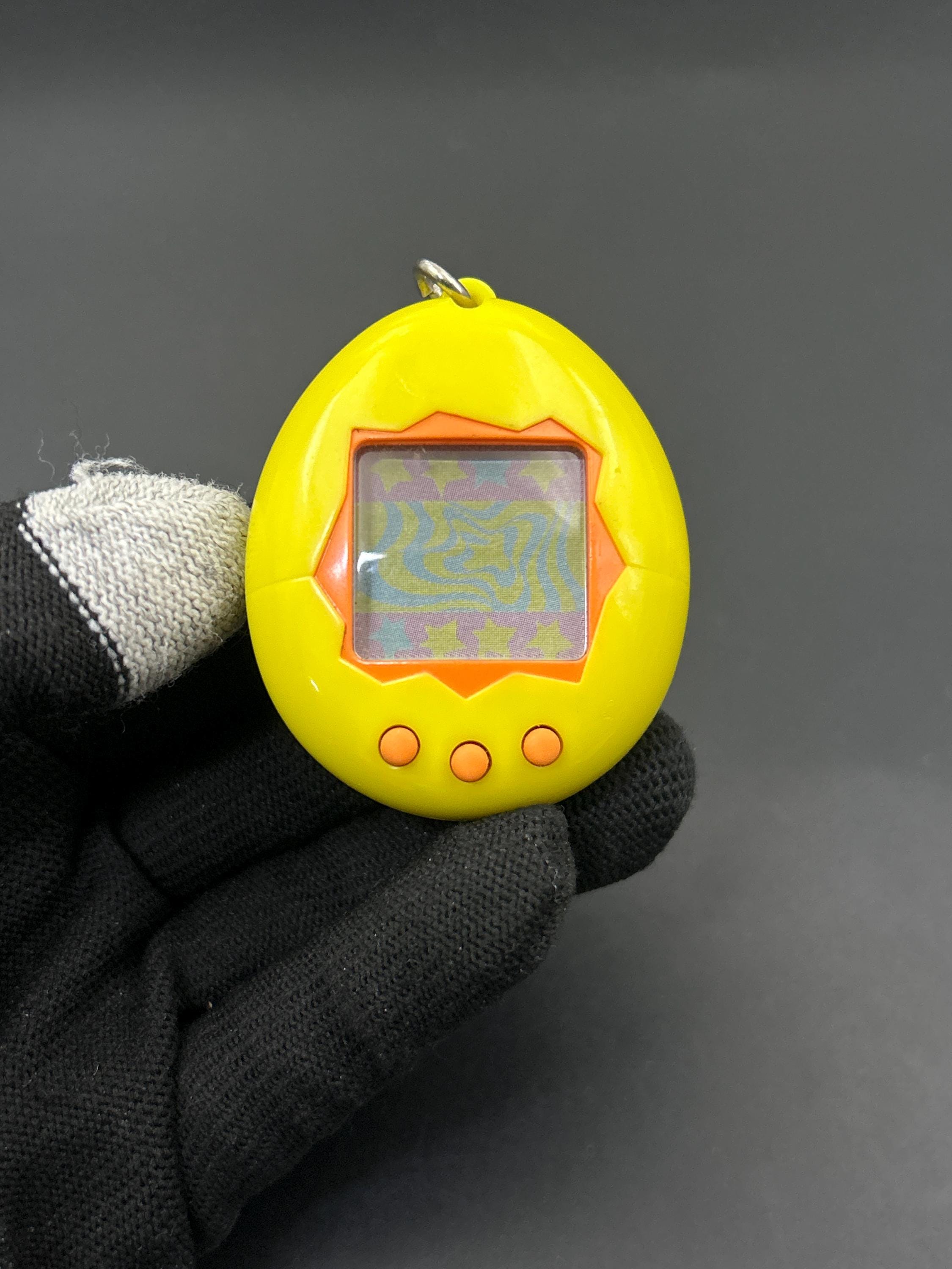 SKU 171260086 | Tamagotchi P1/P2 Yellow First Generation V-pet