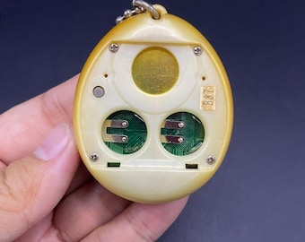 SKU B663P6842 TA8 | ビンテージたまごっちエンジェルイエロー金の羽