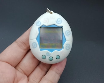 BANDAI ORIGINAL Tamagotchi White With Blue Detail - #1800, 1996