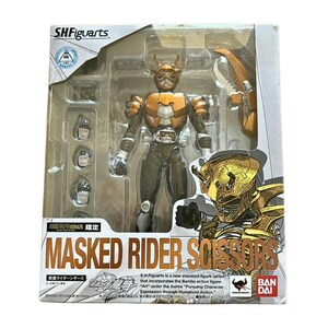 May include: An S.H.Figuarts Masked Rider Scissors action figure in its original packaging. The set includes the articulated gold and black figure, interchangeable hands, and a crab-like weapon accessory. The box features the character name.