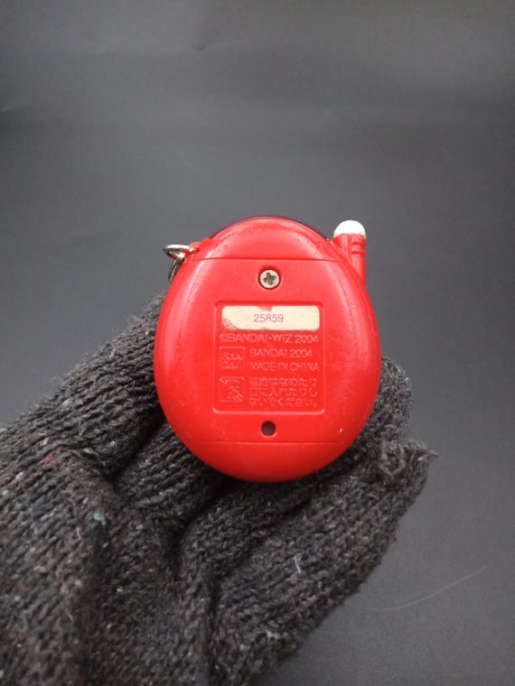 SKU B786P8886 | Tamagotchi Plus Red Bandai Connection V2 Virtual
