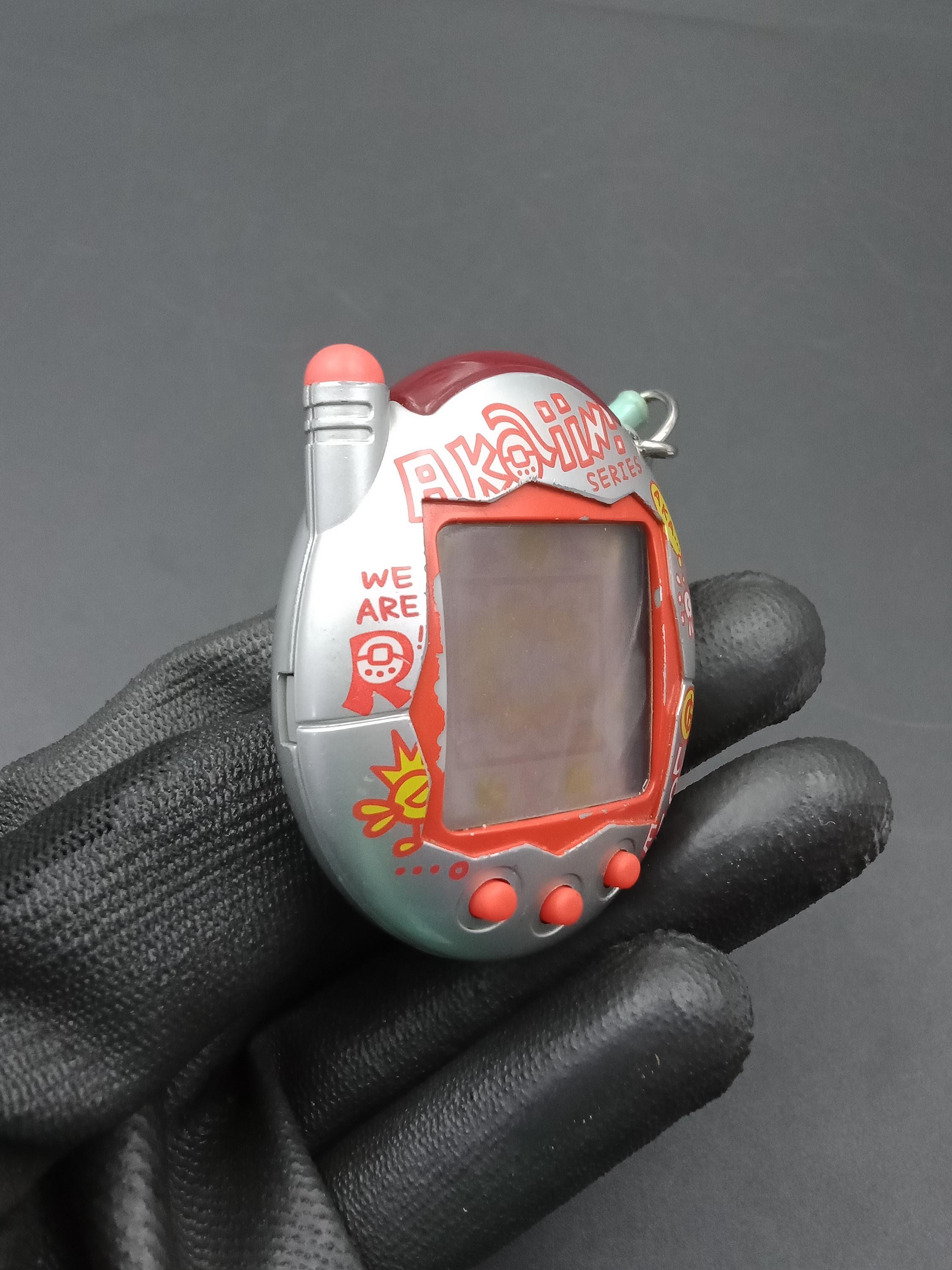 SKU B833P9958 | Bandai Japanese Tamagotchi Connection V3 Akaiin