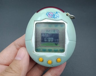 BANDAI ORIGINAL Tamagotchi White With Blue Detail - #1800, 1996