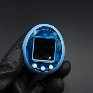 BANDAI ORIGINAL Tamagotchi White With Blue Detail - #1800, 1996