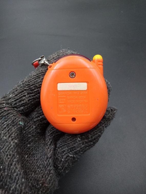 SKU B788P8898 | Tamagotchi Plus Orange Bandai - Etsy Canada