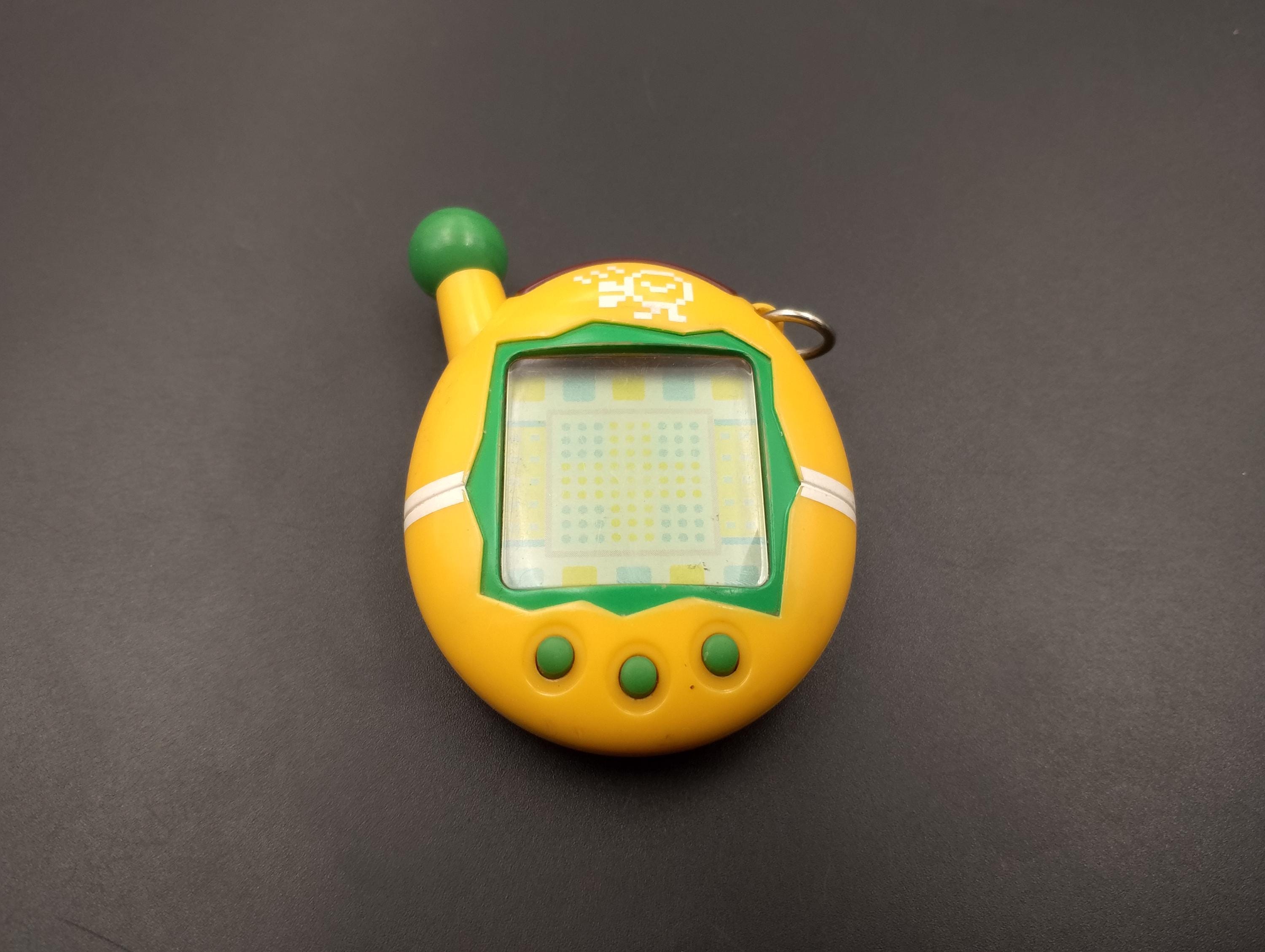 SKU TB F66 | Tamagotchi Connection V4 Yellow Japan Authentic