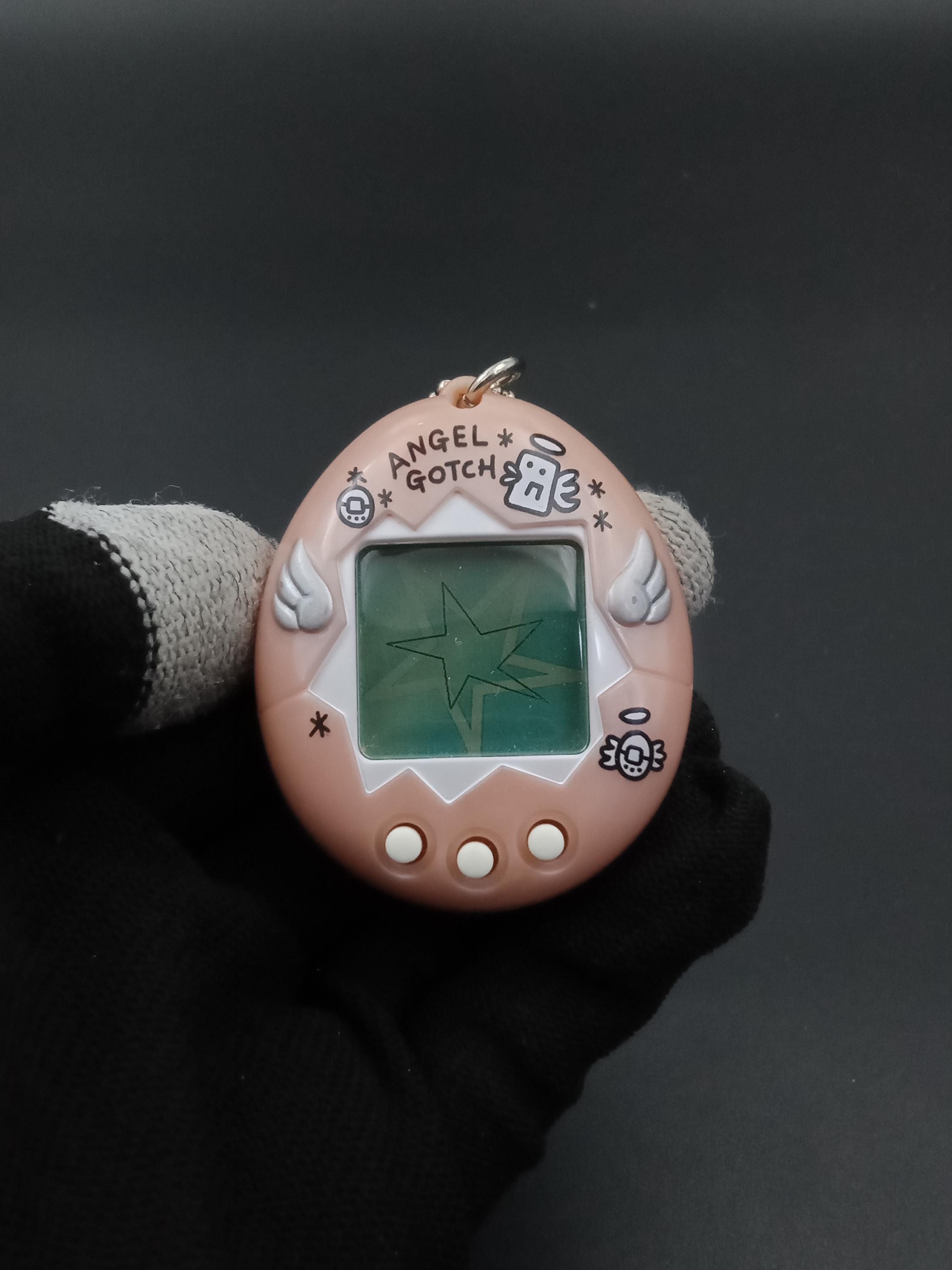 SKU B1152P13813TA4 | Tamagotchi Angel Gotch Pink V-pet Bandai 1997