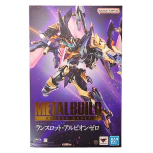 May include: A rectangular product box featuring a dynamic illustration of a dark blue and gold mechanical robot figure. The text reads METAL BUILD DRAGON SCALE, Lancelot Albion Zero, and Bandai Namco. The background is a vibrant purple gradient.