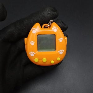 SKU B741P7860 | Vintage game cat tamagotchi
