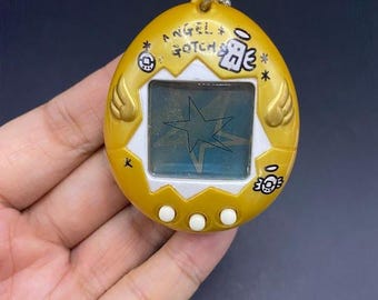 SKU B663P6842 TA8 | Vintage Tamagotchi Angel Yellow With Gold