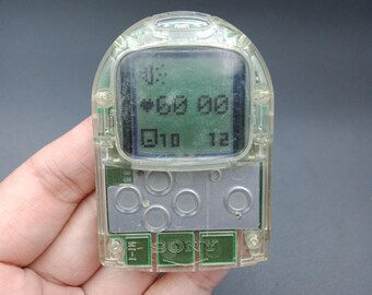 thumbnail image 2 of Sony Pocket Station SCPH-4000 Crystal – NTSC-J PlayStation 1 Memory Card & LCD Toy 2 of 6