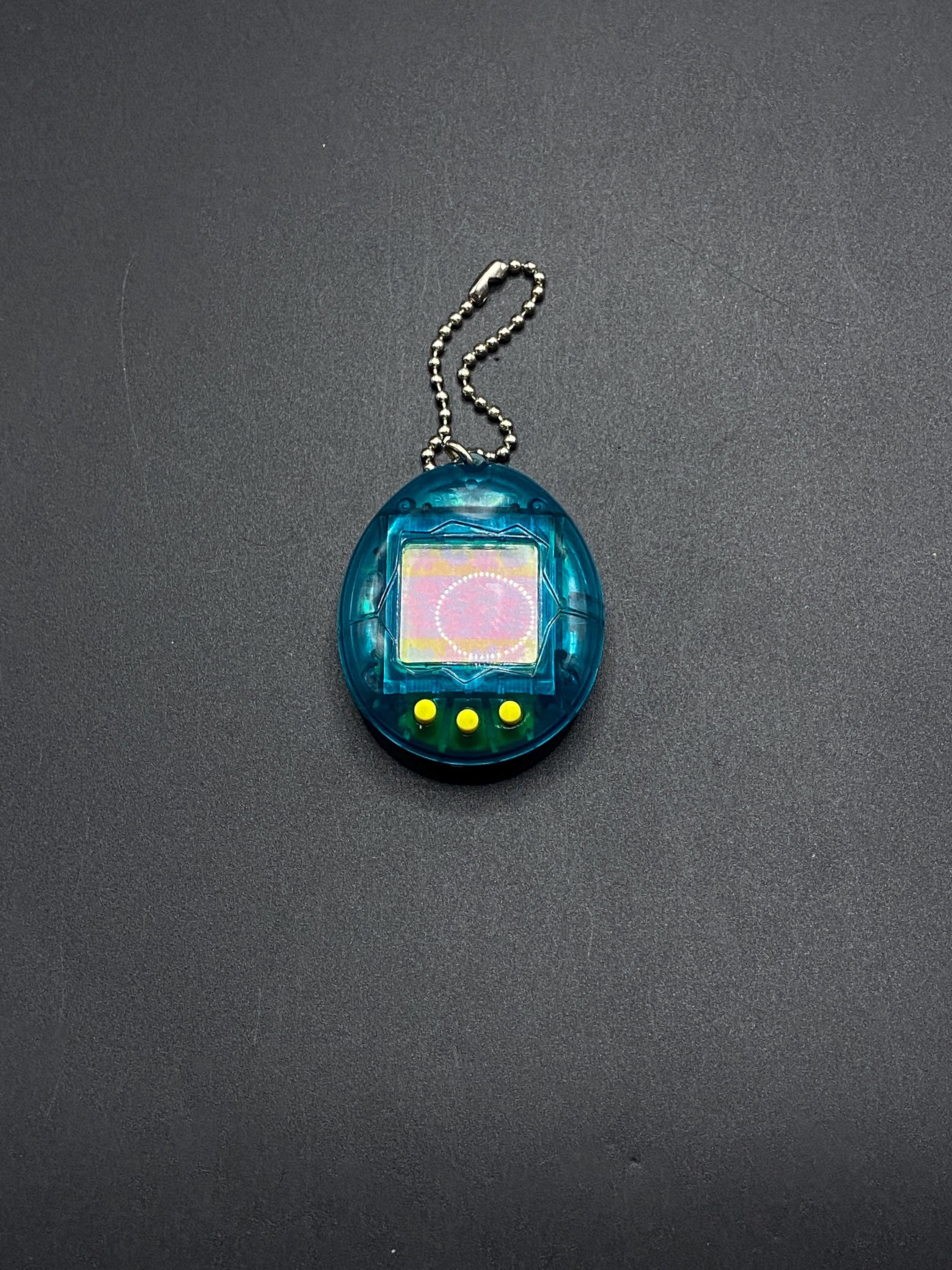 SKU B140P874TA | Tamagotchi Clear Blue Bandai 1997 Authentic Toy