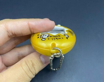 SKU B663P6842 TA8 | Vintage Tamagotchi Angel Yellow With Gold