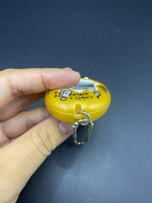 SKU B663P6842 TA8 | Vintage Tamagotchi Angel Yellow With Gold