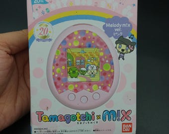 SKU YU346 / Tamagotchi Mix Rosa Bandai Japonés V mascota