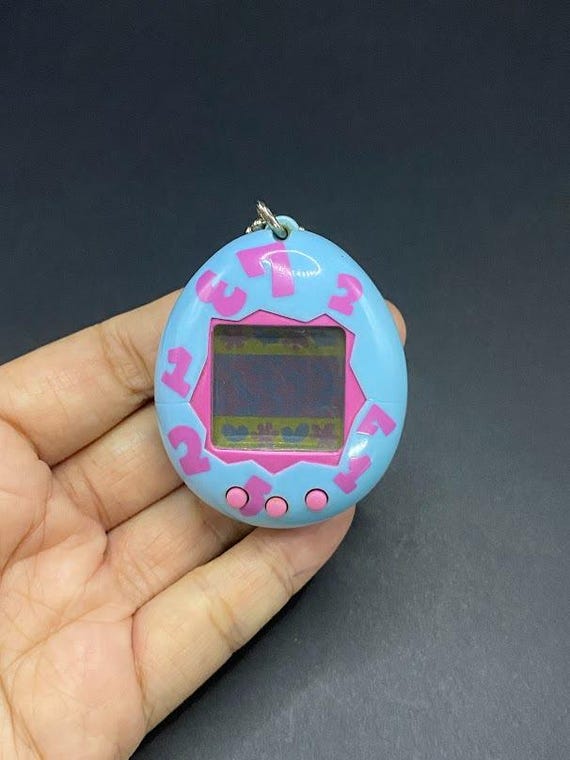 tomi SKU B562P6686 TA6 | Tamagotchi Original Gen 1 Vintage 1996. Works