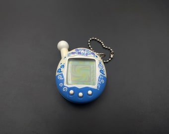SKU B140P874TA | Tamagotchi Clear Blue Bandai 1997 Authentic