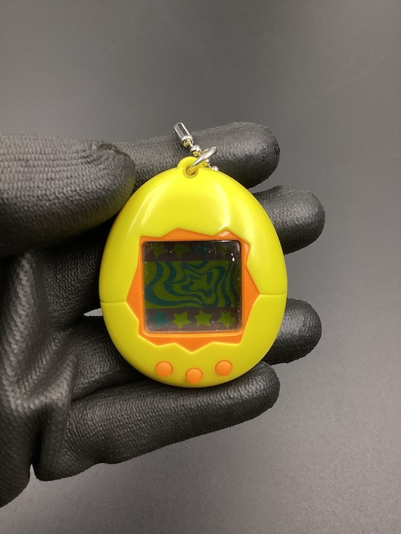 Supreme® Tamagotchi Yellow Supreme Bandai Namco Tamagotchi Yellow - SS23 - Brand New W