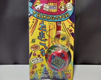 691907006 | Tamagotchi Original Red with Numbers shell Bandai