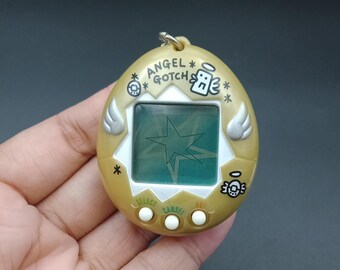 UGS B924P11719TA4 | Bandai Tamagotchi Angelgotchi Angel Gotch