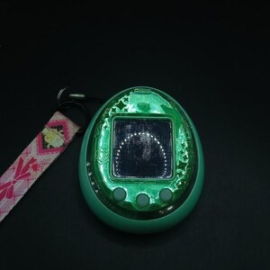 SKU B697P7262 | Tamagotchi Idl Green Pet Game Bandai Tested Japan