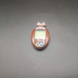 SKU | Tamagotchi Mushi Beetle Brown Bandai Japanese version