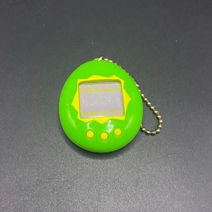 SKU B668P6926TA8 | Bandai Tamagotchi P1 Gen 1 Green & Yellow Digital Virtual Pet Toy