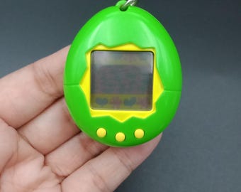 Tamagotchi First Generation Japan Ver., Green Skelton | Bandai