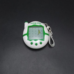 SKU B740P7856 | Bandai Tamagotchi Plus Keitai Hanerutchi