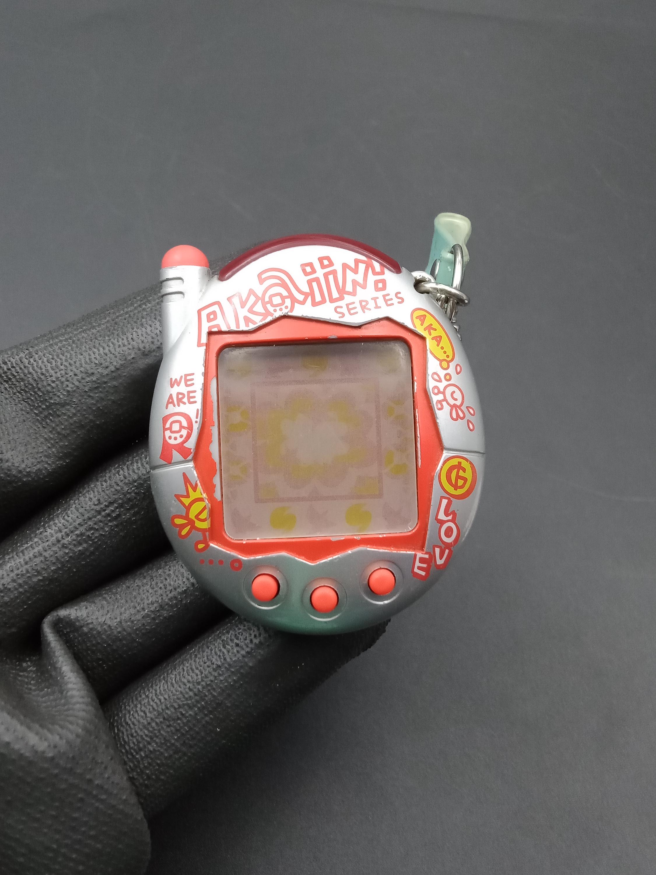 SKU B833P9958 | Bandai Japanese Tamagotchi Connection V3 Akaiin