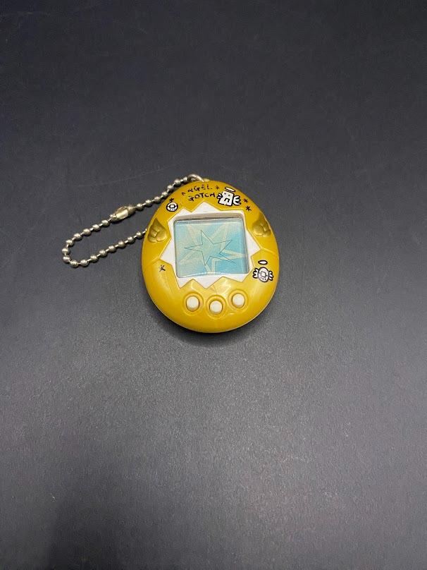 SKU B663P6842 TA8 | Vintage Tamagotchi Angel Yellow With Gold