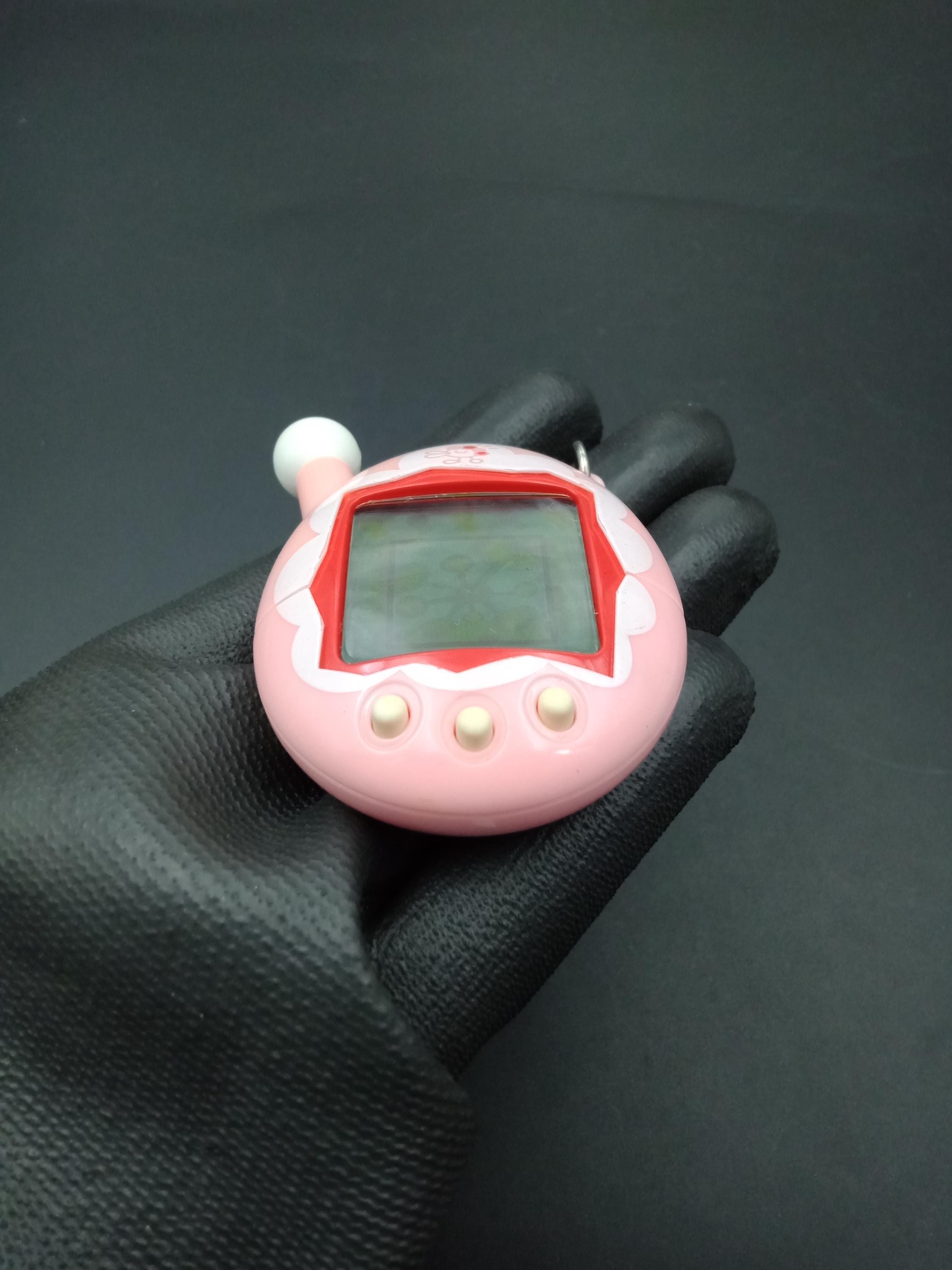 SKU B833P9932 | Bandai Japanese Tamagotchi V4 Pink Connection