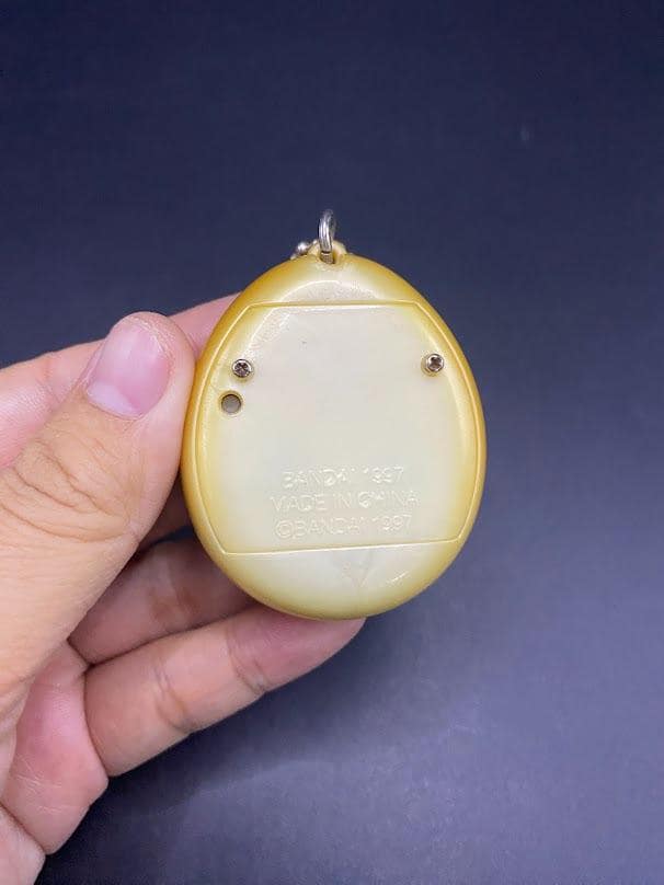 SKU B663P6842 TA8 | Vintage Tamagotchi Angel Yellow With Gold
