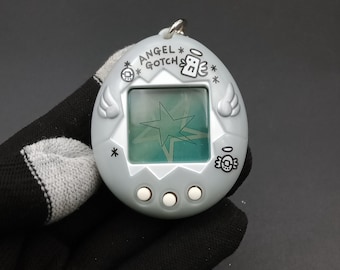 SKU B913P11653TA8 | Bandai Tamagotchi Angel Gotch Silver - Etsy