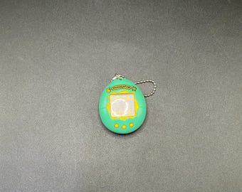 SKU B404P4577 | BANDAI 1st Generation Tamagotchi Green 1996 Japanese version