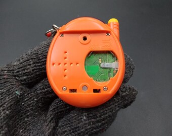 SKU B788P8898 | Tamagotchi Plus Orange Bandai - Etsy Canada