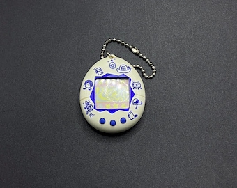 BANDAI ORIGINAL Tamagotchi White With Blue Detail - #1800, 1996